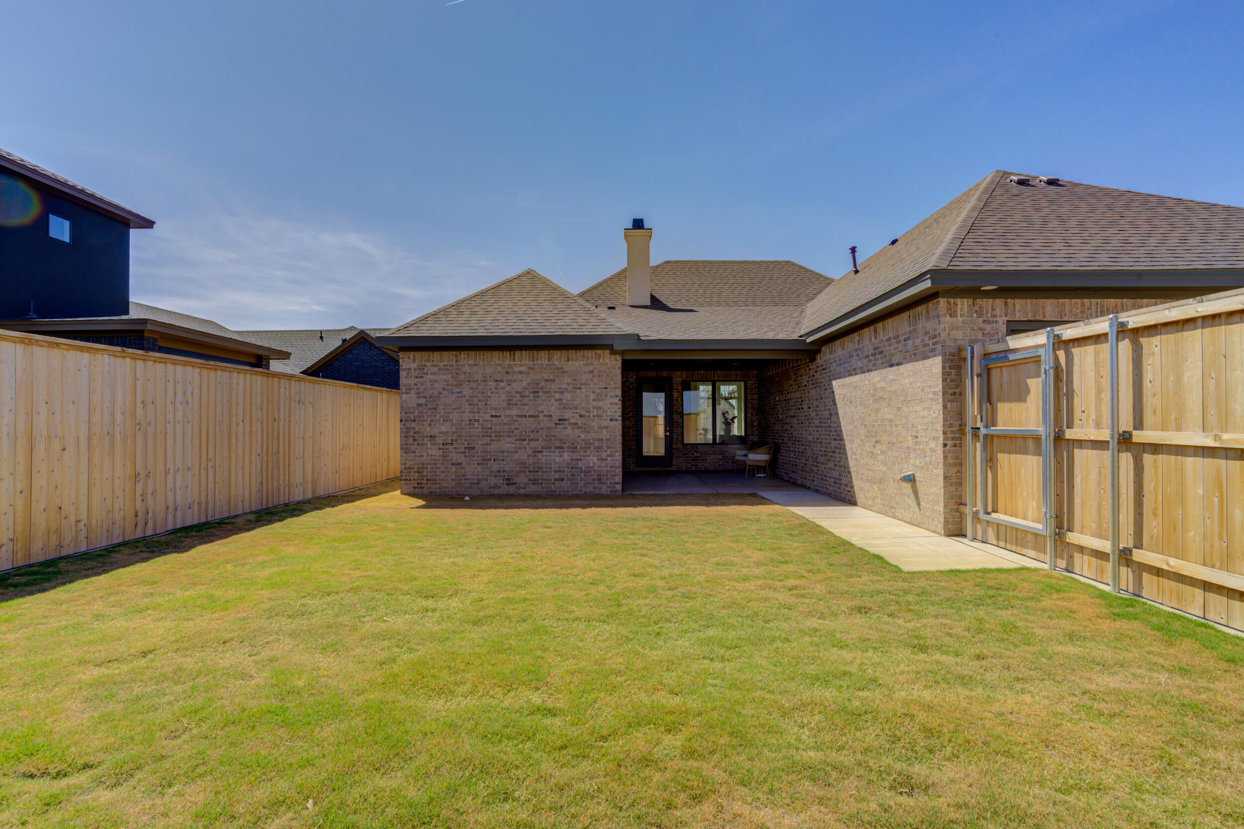 4610 138th Place Lubbock, TX 79424 - Photo 51 of 52 a front view of a house with a yard