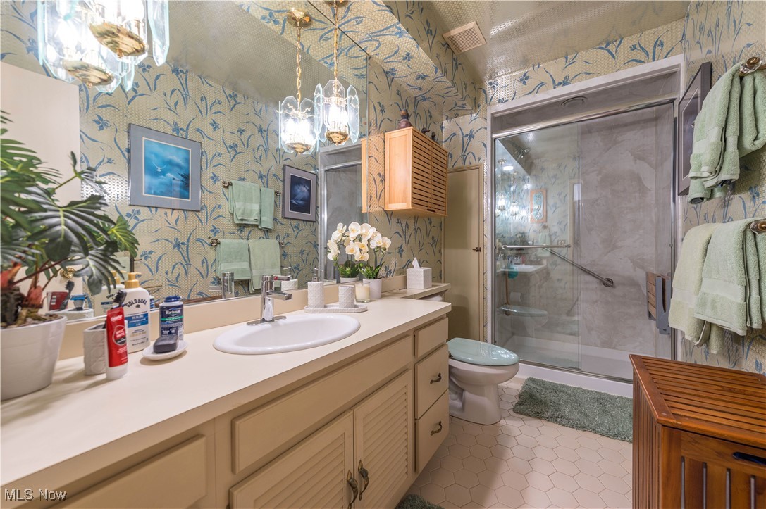 2660 Ramsay Road Beachwood, OH 44122 - Photo 35 of 49 Bathroom with wallpapered walls, vanity, a stall shower, and light tile patterned flooring