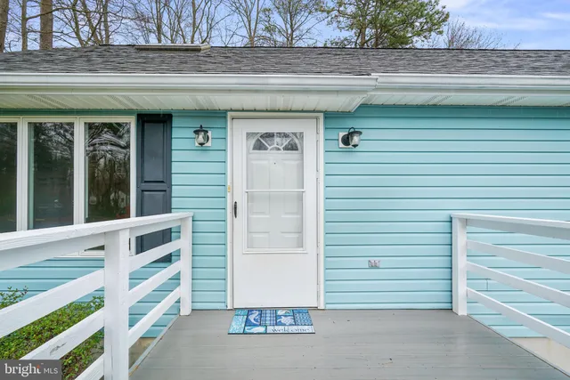 a view of front door and bedroom