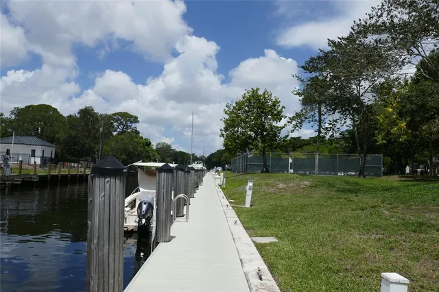 a view of a lake with a house in the background