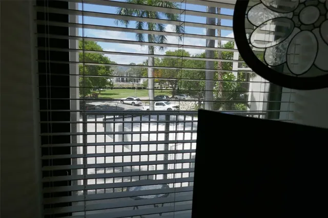 a bathroom with a mirror and a shower