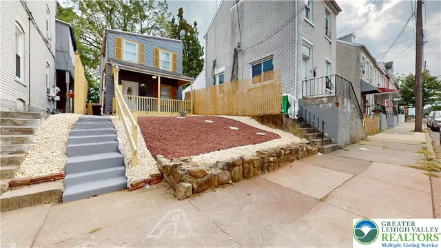 a view of a street with brick building in front of it
