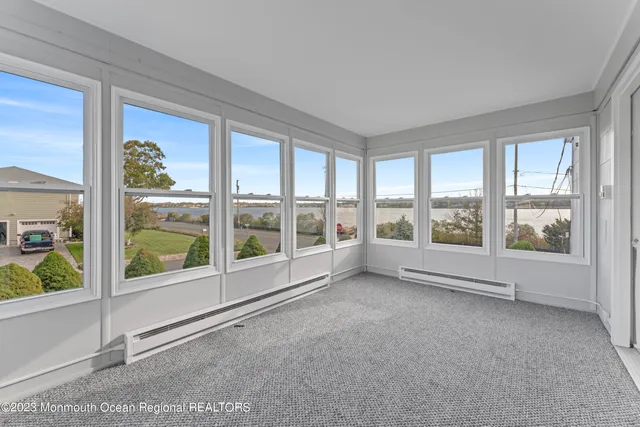 a view of a room that has a large window