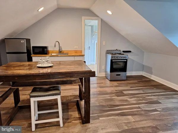 a kitchen with a stove and a refrigerator