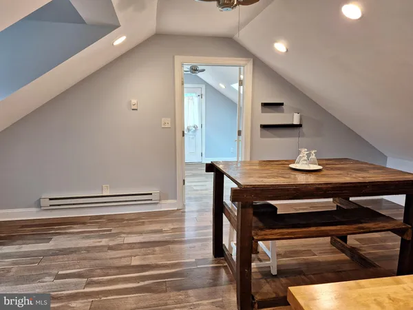 a view of kitchen with cabinets and wooden floor