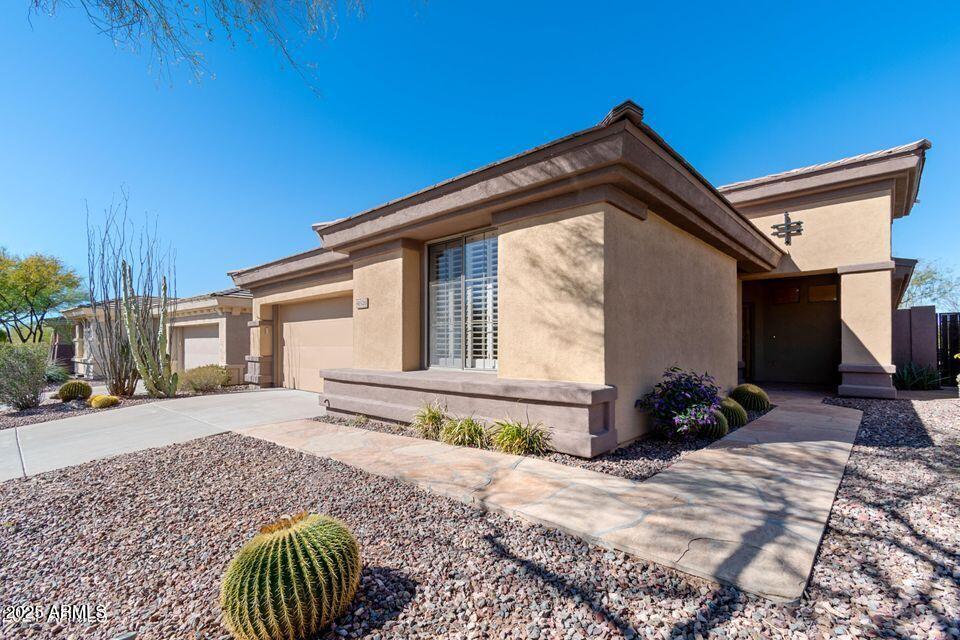 41526 North Cedar Chase Road Anthem, AZ 85086 - Photo 1 of 14 a front view of a house with garden