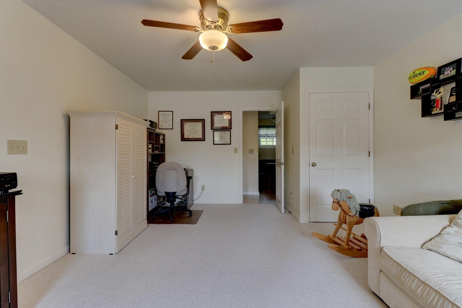 206 Ridgeview Road Blue Ridge, VA 24064 - Photo 22 of 44 a room with a closet and a ceiling fan