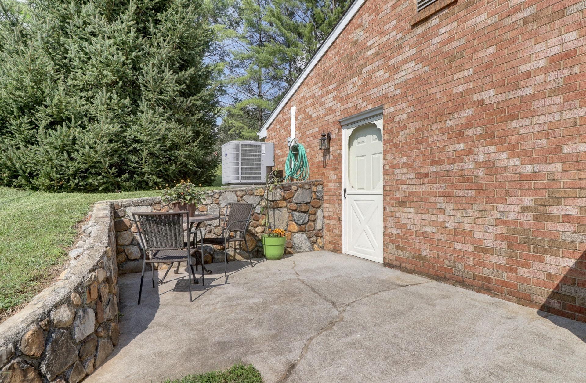 206 Ridgeview Road Blue Ridge, VA 24064 - Photo 36 of 44 a view of a patio with table and chairs and potted plants
