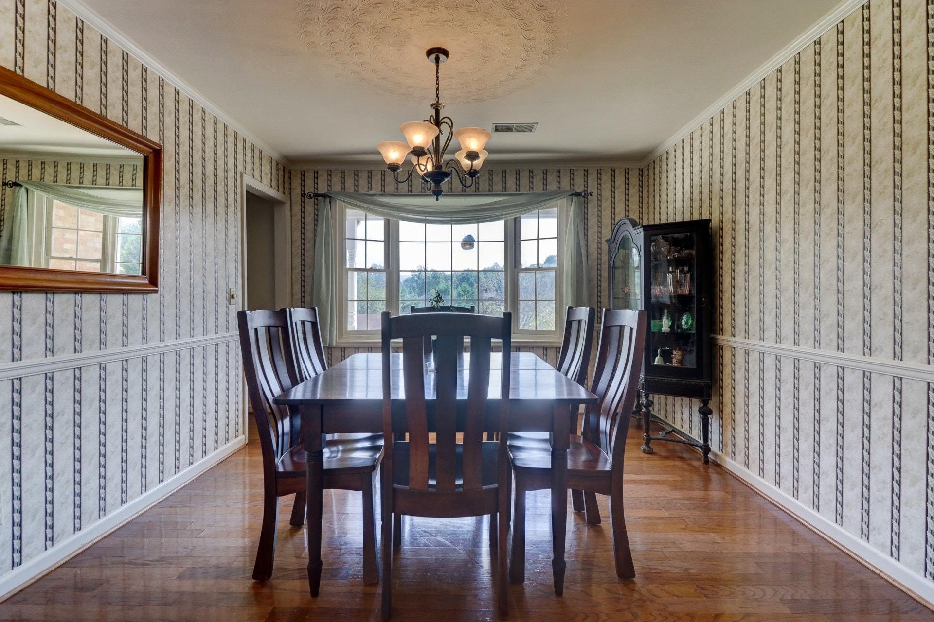 206 Ridgeview Road Blue Ridge, VA 24064 - Photo 10 of 44 a view of a dining room with furniture window and wooden floor