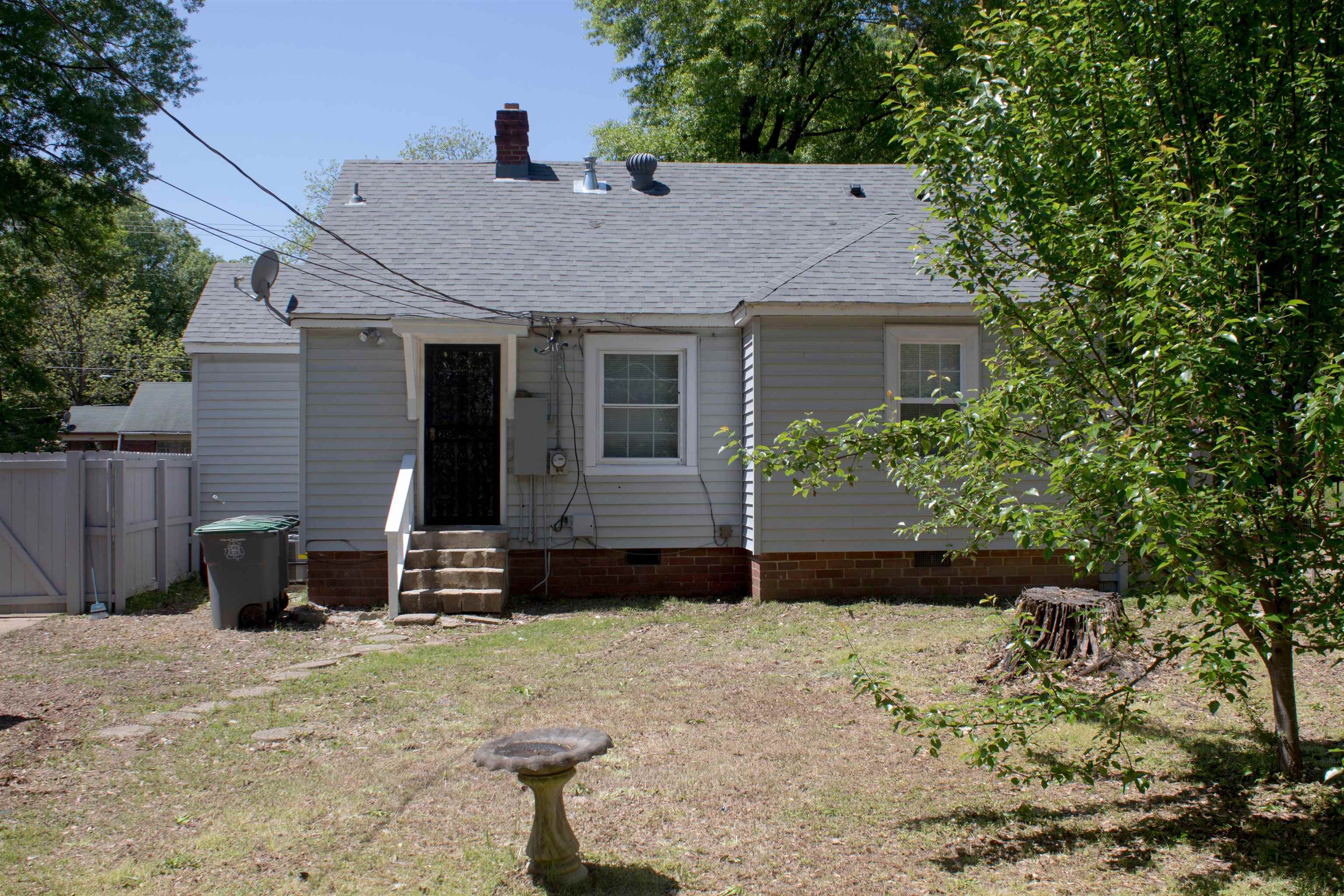 1058 Prescott Road Memphis, TN 38111 - Photo 15 of 16 a view of a house with a yard
