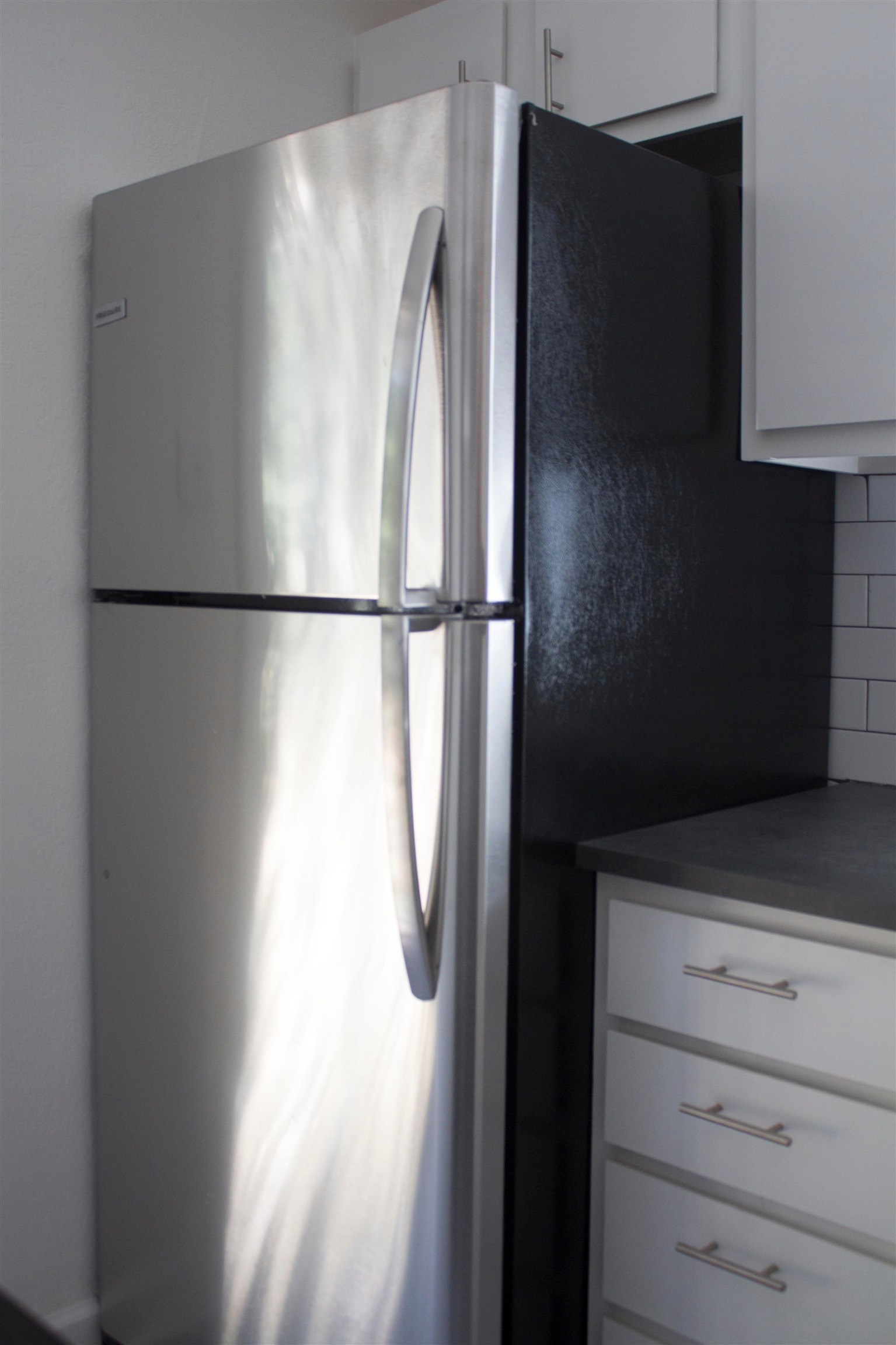 1058 Prescott Road Memphis, TN 38111 - Photo 7 of 16 a view of a refrigerator in kitchen and dishwasher