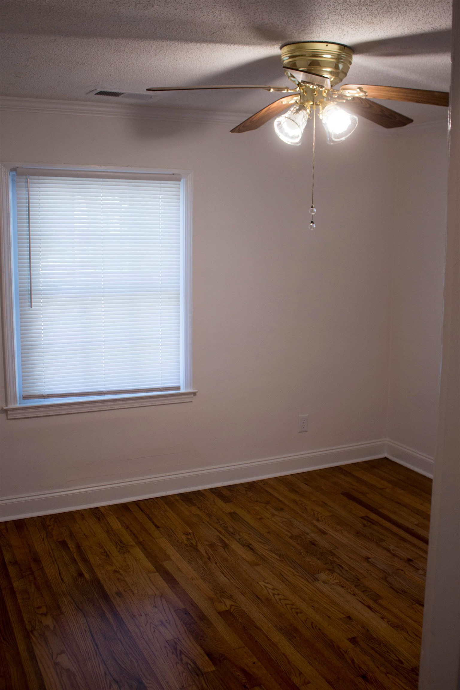 1058 Prescott Road Memphis, TN 38111 - Photo 10 of 16 a view of a room with wooden floor fan and window