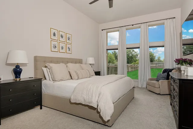 a bathroom with a tub sink a mirror and a shower