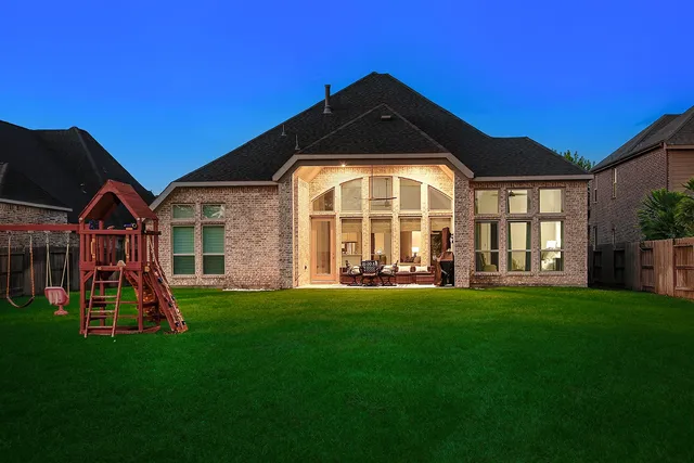 a view of a chairs and table in the balcony
