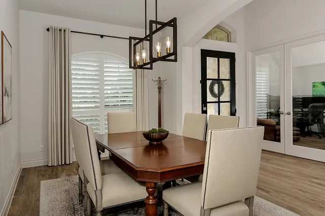 a view of a dining room with furniture and wooden floor