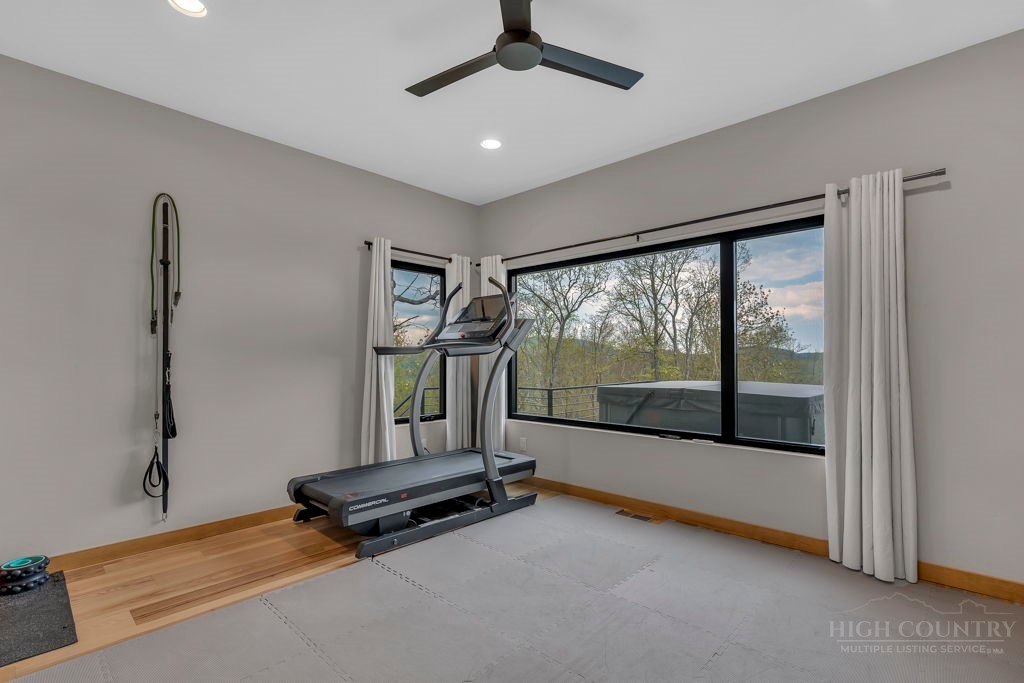 799 Milton Brown Heirs Road Boone, NC 28607 - Photo 40 of 49 a room with gym equipment and a large window