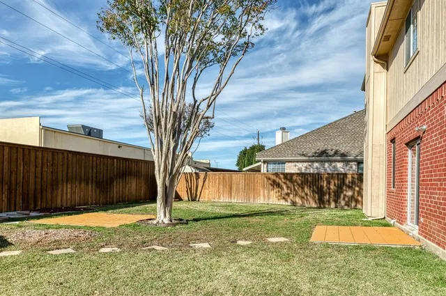 a backyard of a house with lots of green space