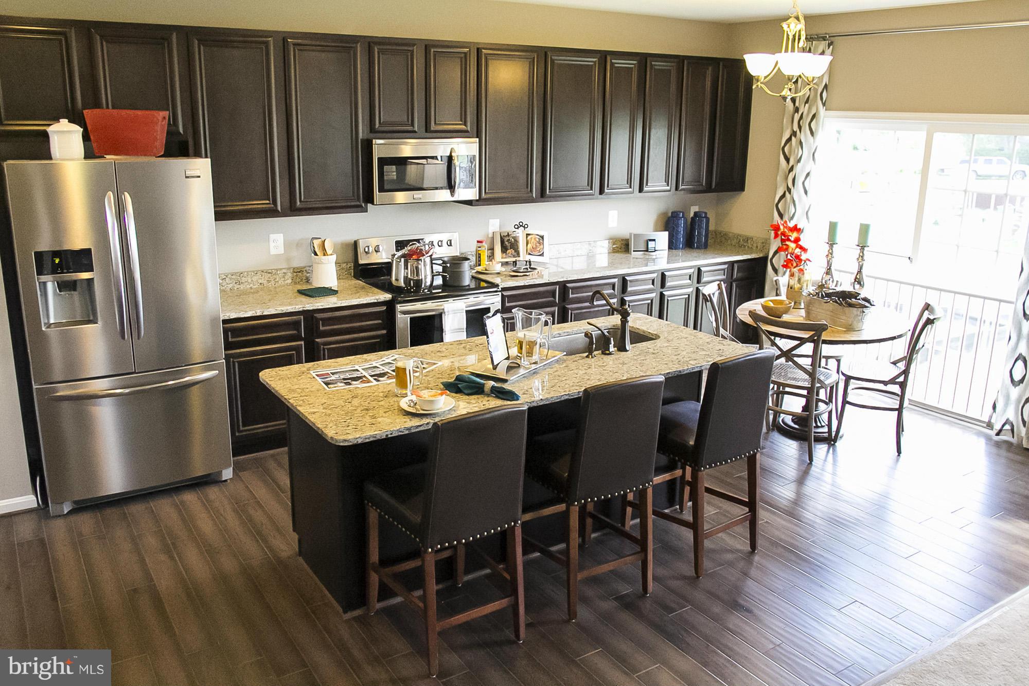 2537 Easy Street Fallston, MD 21047 - Photo 2 of 19 a kitchen with a dining table chairs and refrigerator
