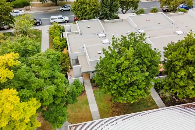 an aerial view of a pool table and chairs