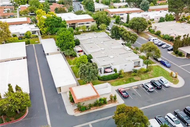 an aerial view of a house with a yard basket ball court and outdoor seating