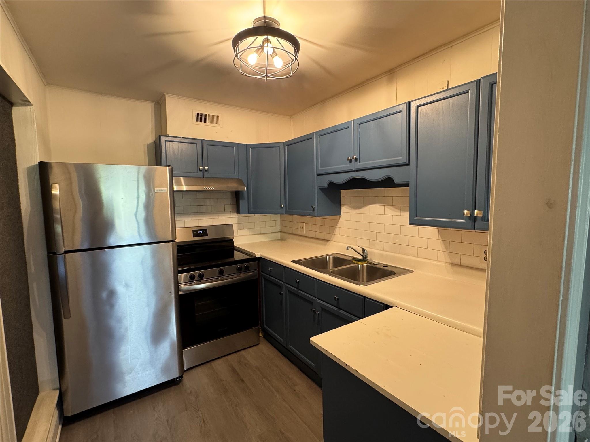 24016 Tidal Way Fort Mill, SC 29708 - Photo 6 of 9 a kitchen with stainless steel appliances granite countertop a refrigerator a stove and a refrigerator