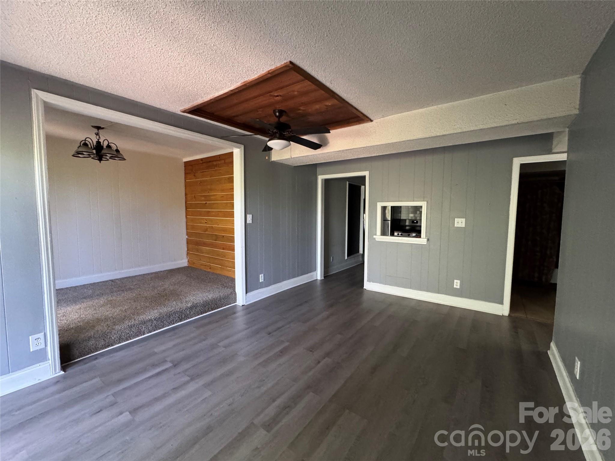 24016 Tidal Way Fort Mill, SC 29708 - Photo 7 of 9 a view of an empty room with wooden floor and a ceiling fan