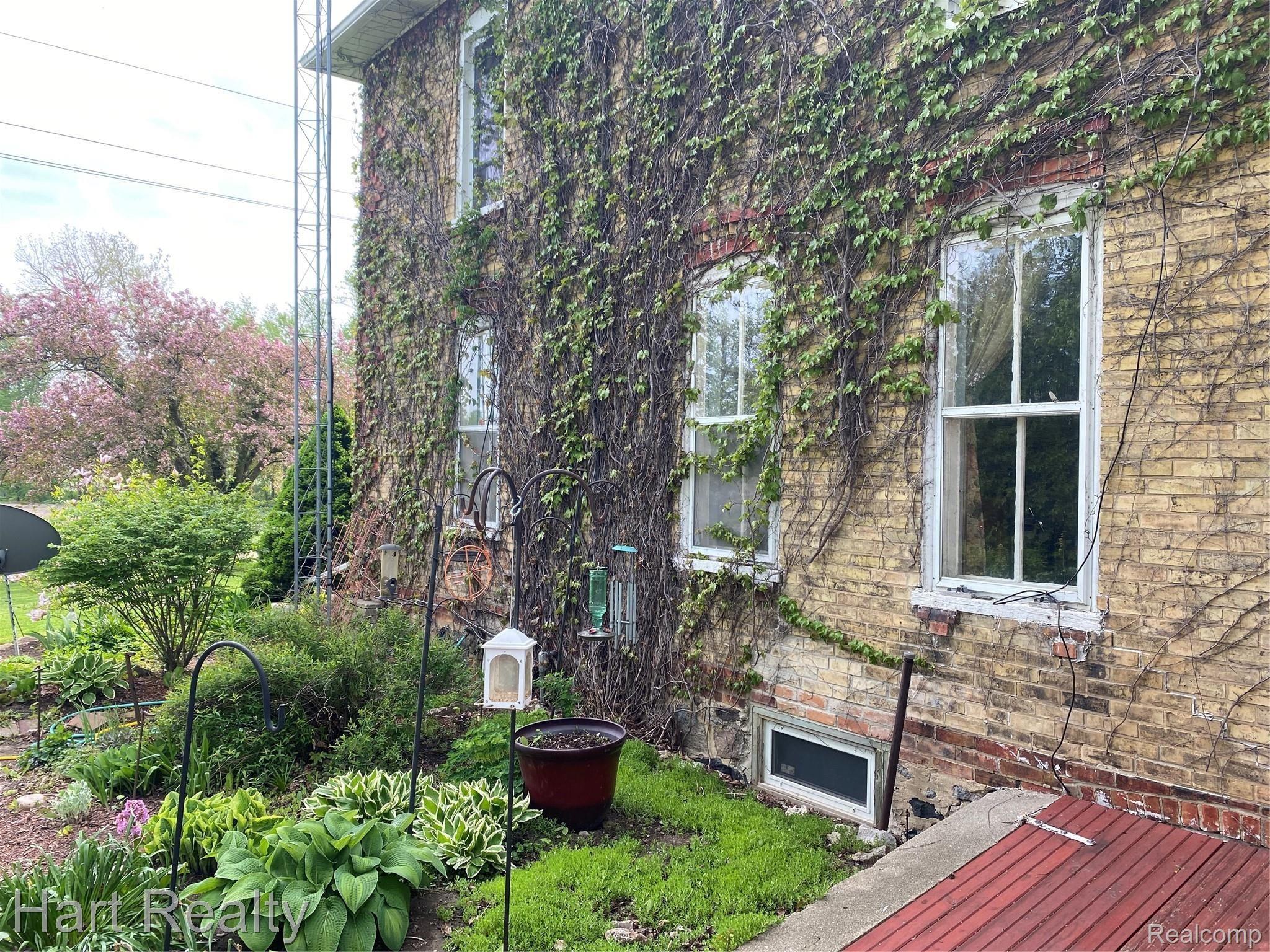 5910 Walker Road Marlette, MI 48453 - Photo 8 of 51 Ivy covered brick- makes me think of a manor!