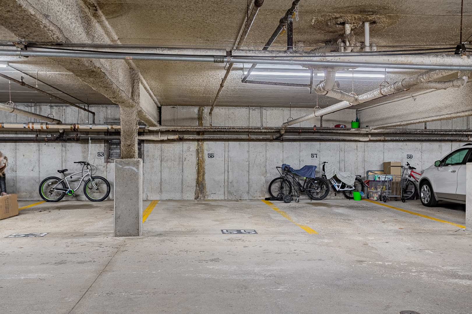 520 Biesterfield Road, Unit E220 Elk Grove Village, IL 60007 - Photo 16 of 21 a view of parking garage with cars
