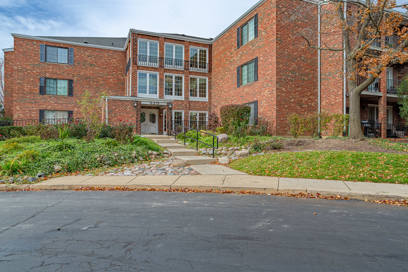 520 Biesterfield Road, Unit E220 Elk Grove Village, IL 60007 - Photo 2 of 21 front view of a brick building
