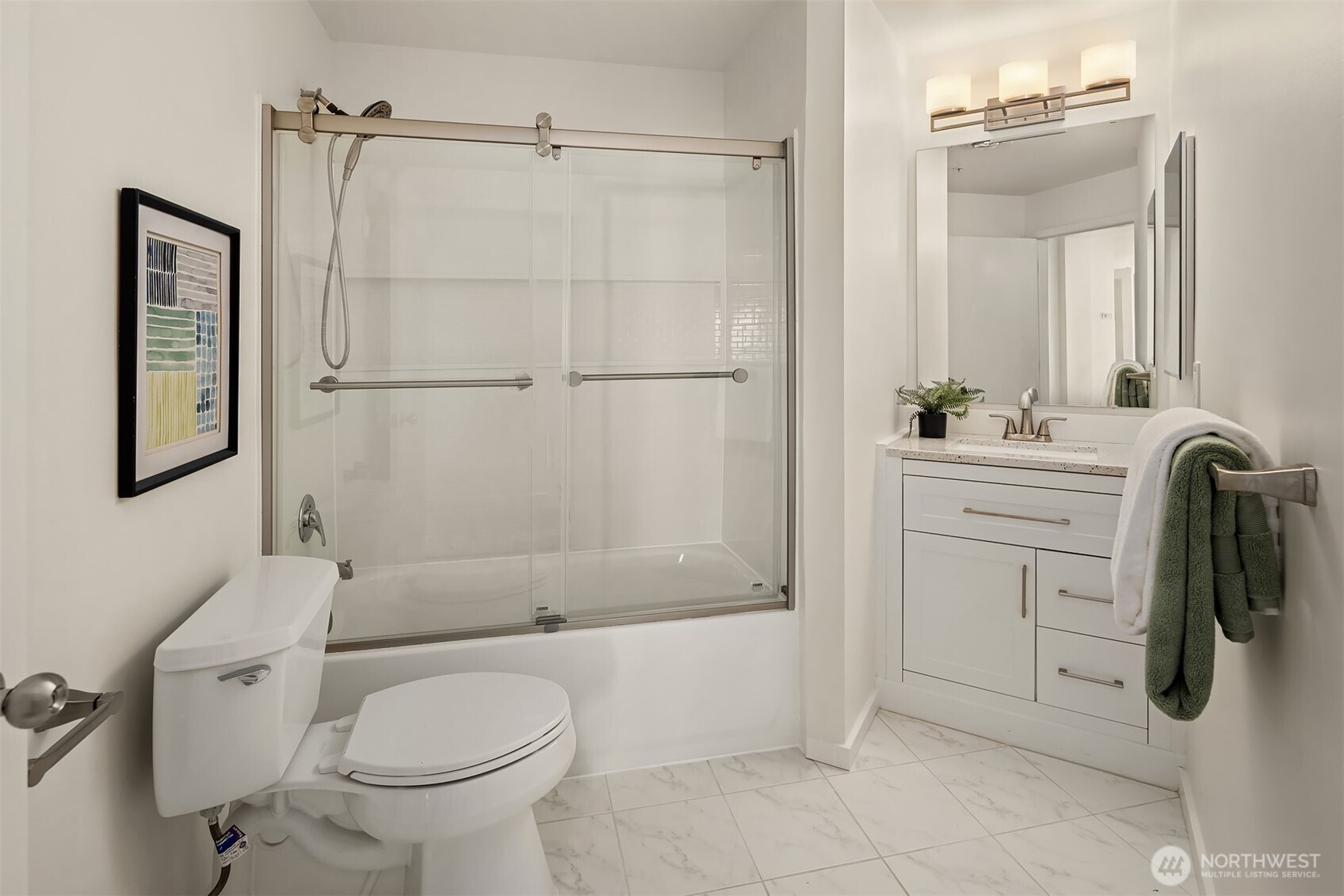 4528 8th Avenue Northeast, Unit 5A Seattle, WA 98105 - Photo 12 of 27 a bathroom with a sink toilet and shower