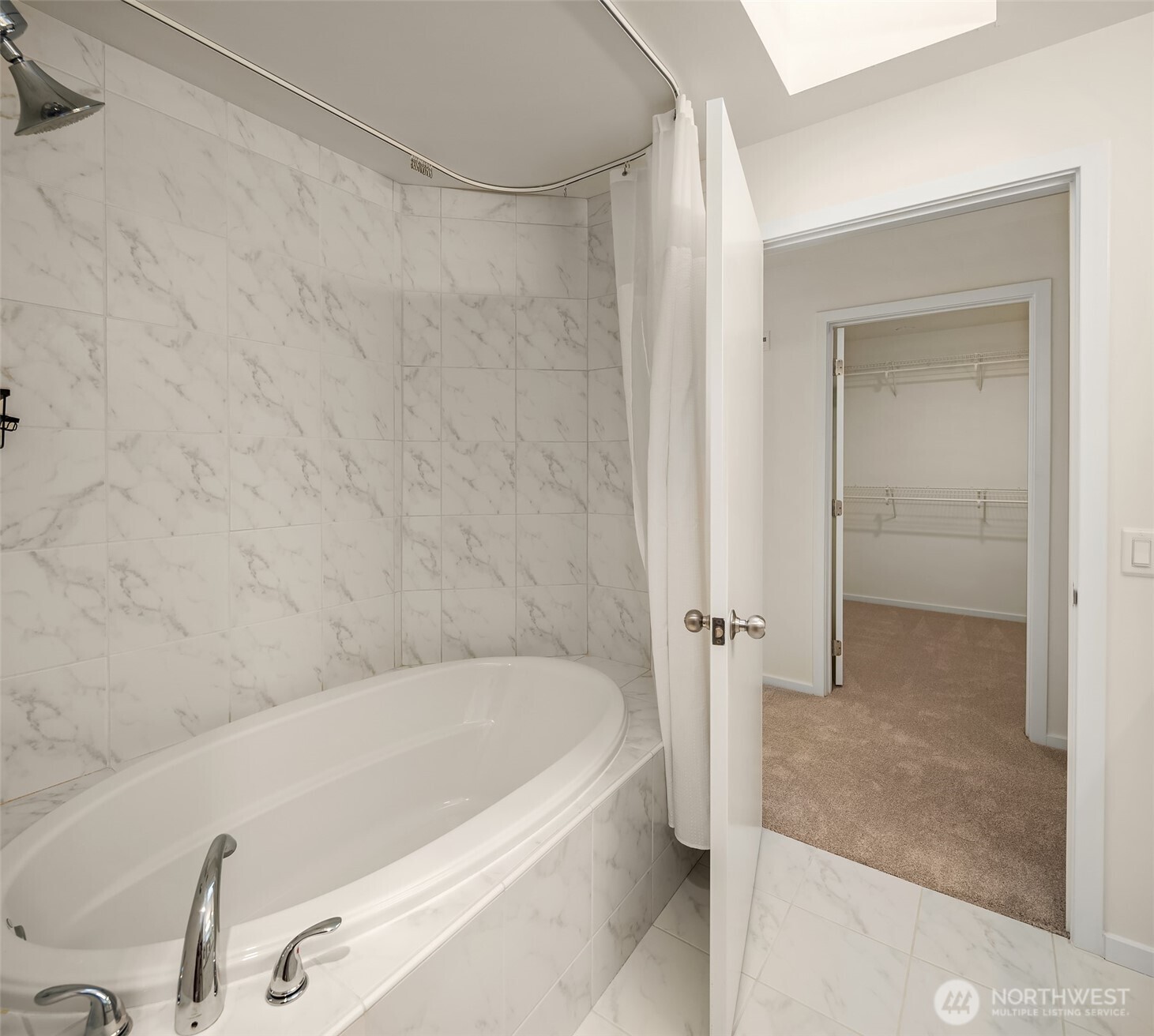 4528 8th Avenue Northeast, Unit 5A Seattle, WA 98105 - Photo 17 of 27 a bathroom with a tub and shower