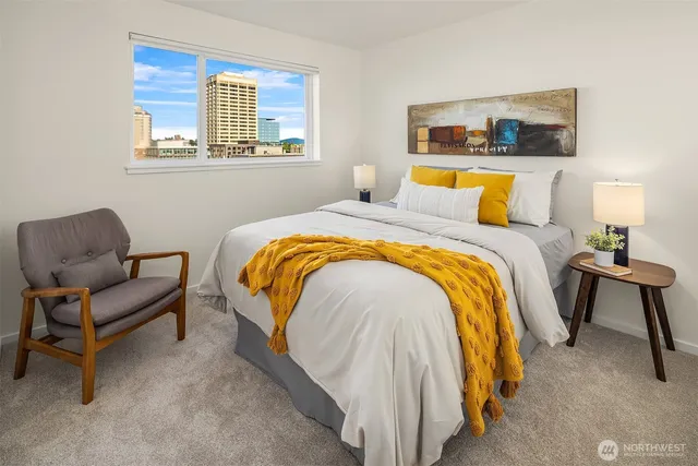 a bedroom with a bed and chair