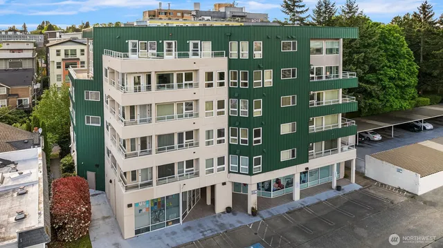 a view of a building with a yard