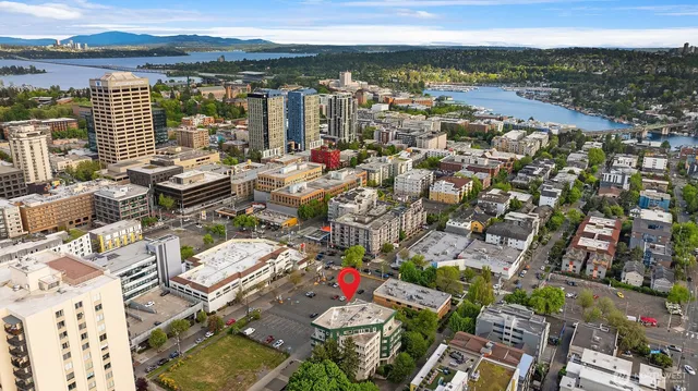 a front view of a building with glass windows and a table