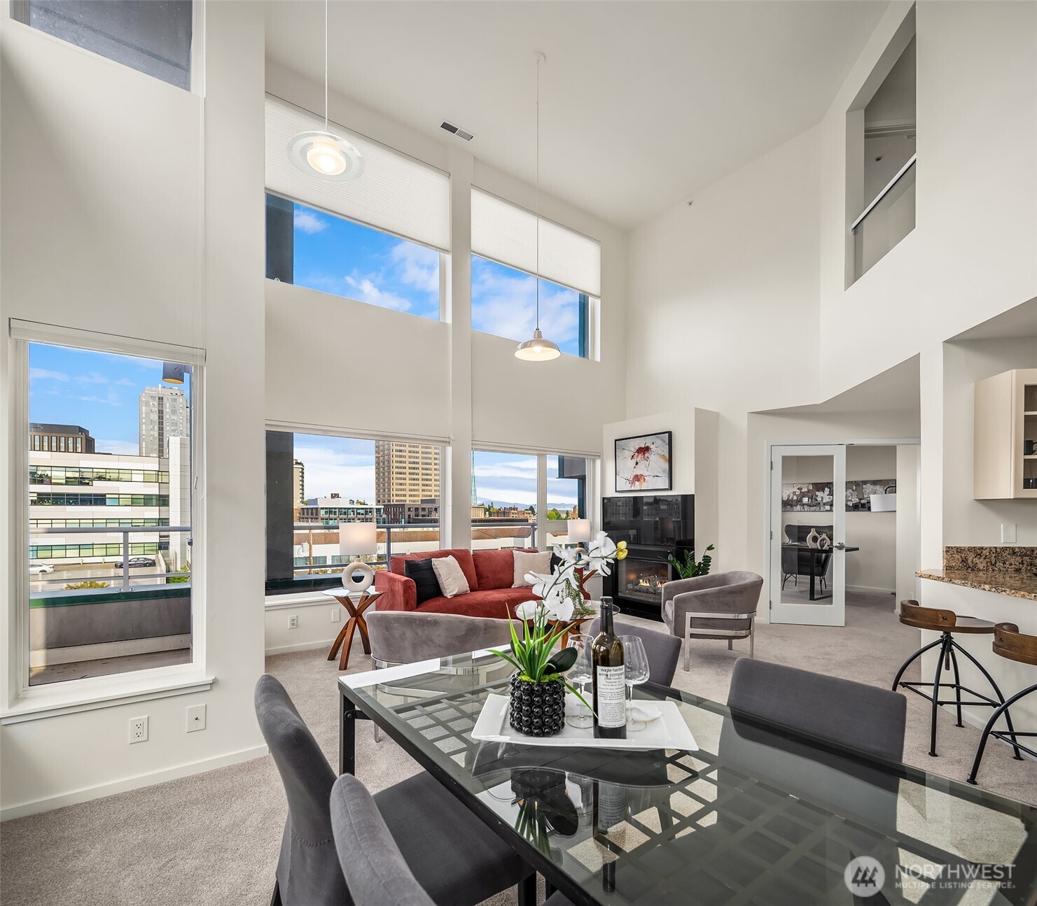 4528 8th Avenue Northeast, Unit 5A Seattle, WA 98105 - Photo 3 of 27 a living room with furniture kitchen view and a large window