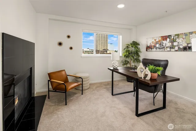 a room with furniture and a potted plant