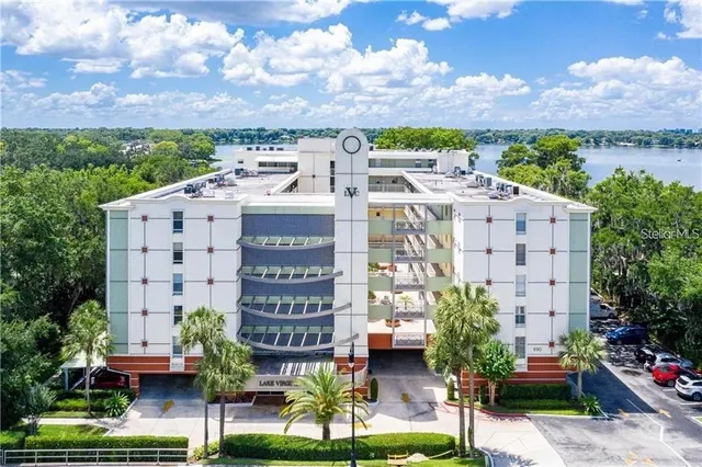 a view of a building with garden space and street view