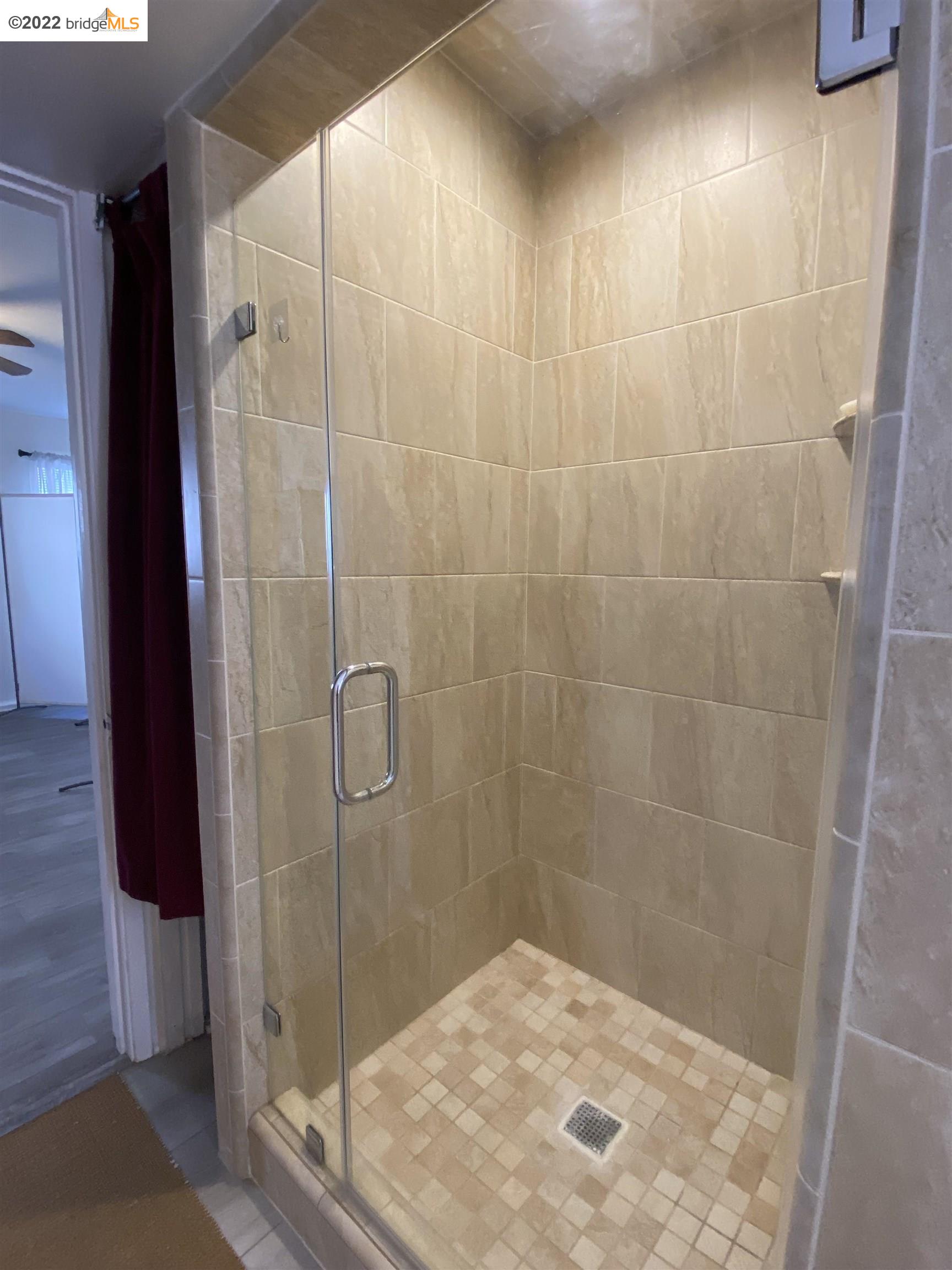 5357 Bryant Avenue Oakland, CA 94618 - Photo 17 of 26 a bathroom with a shower