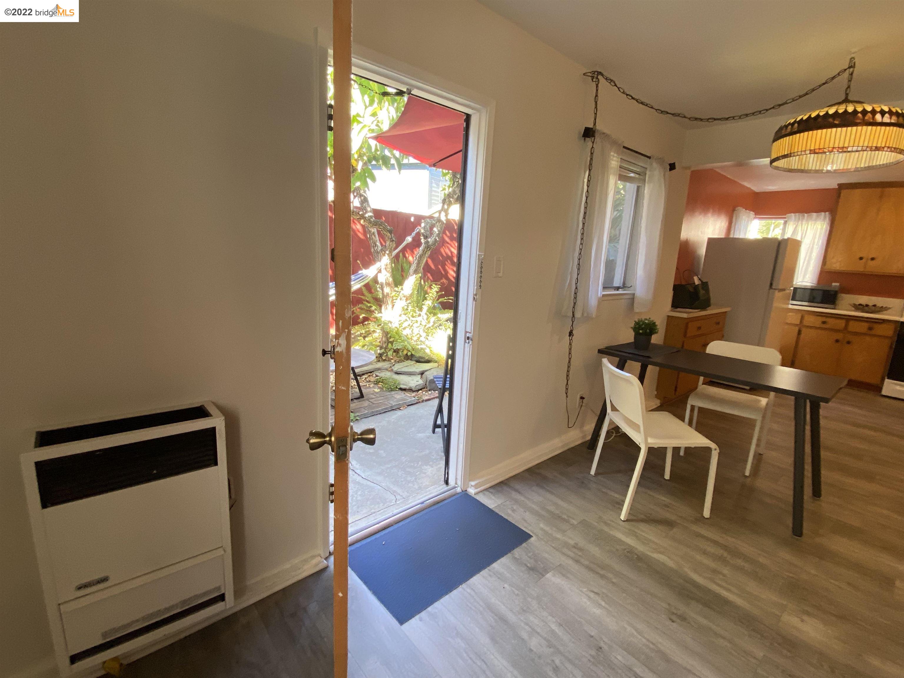 5357 Bryant Avenue Oakland, CA 94618 - Photo 2 of 26 a view of a room with furniture and wooden floor