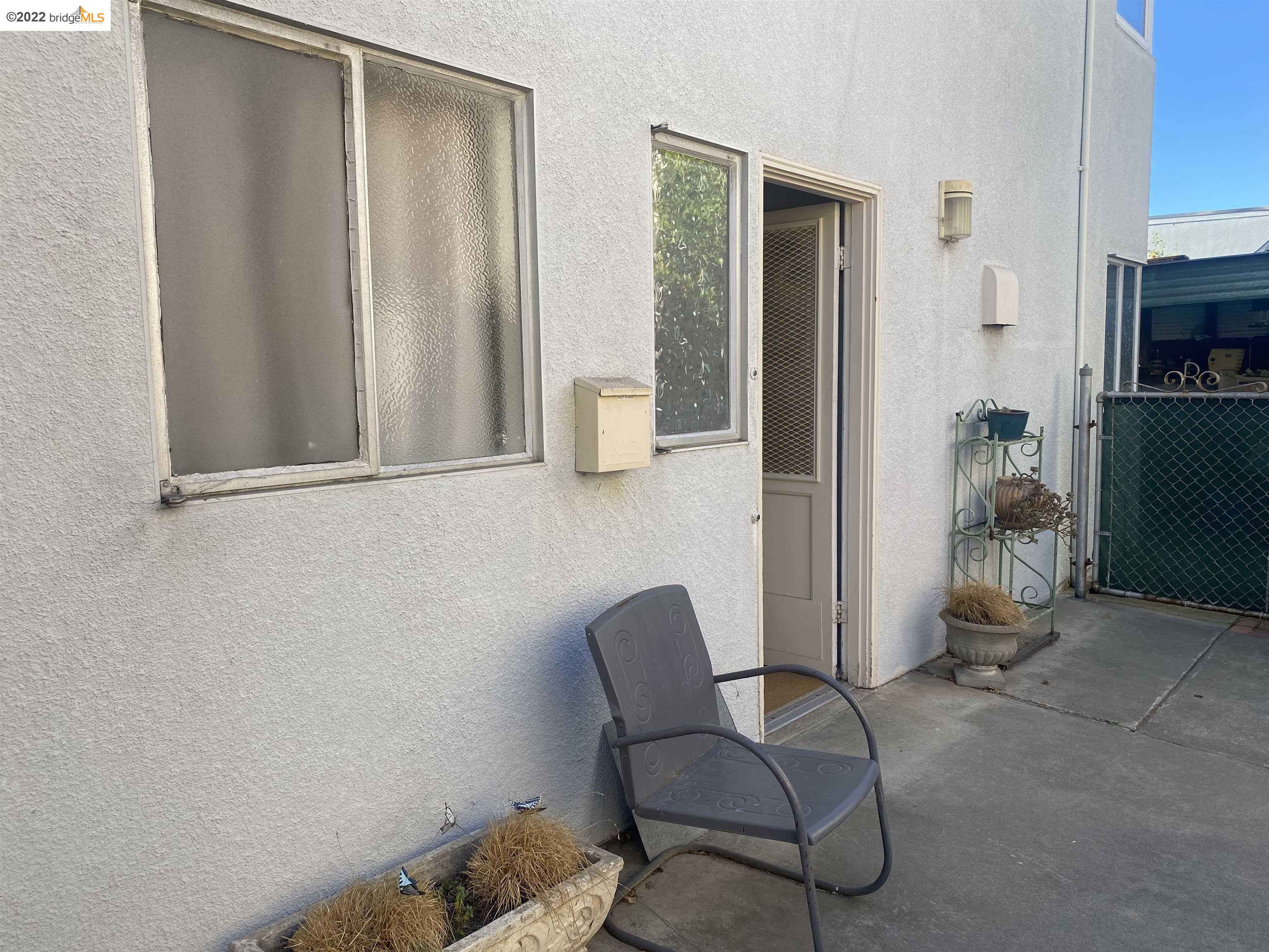 5357 Bryant Avenue Oakland, CA 94618 - Photo 24 of 26 a living room with furniture and a window
