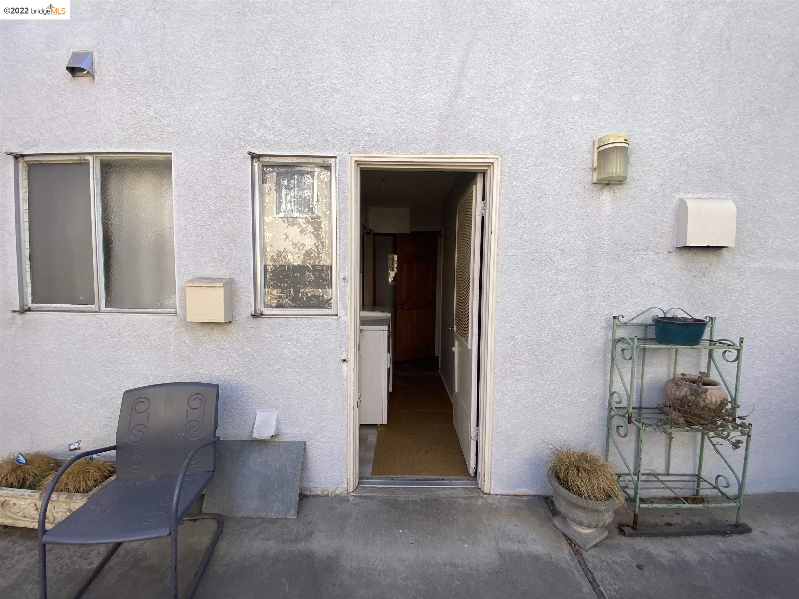 5357 Bryant Avenue Oakland, CA 94618 - Photo 25 of 26 a living room with furniture and a window