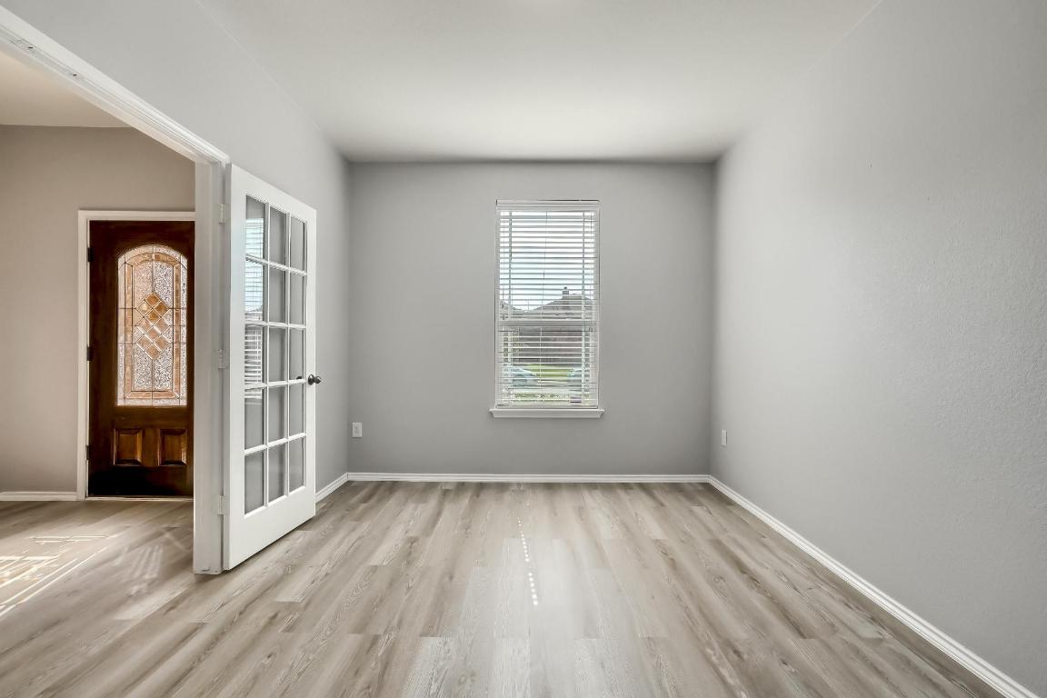 7308 Altidore Drive Austin, TX 78744 - Photo 20 of 24 Unfurnished room with light wood-type flooring