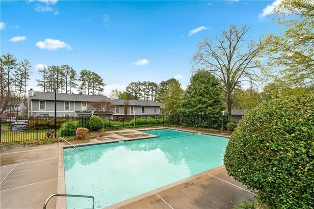 a view of swimming pool from a balcony