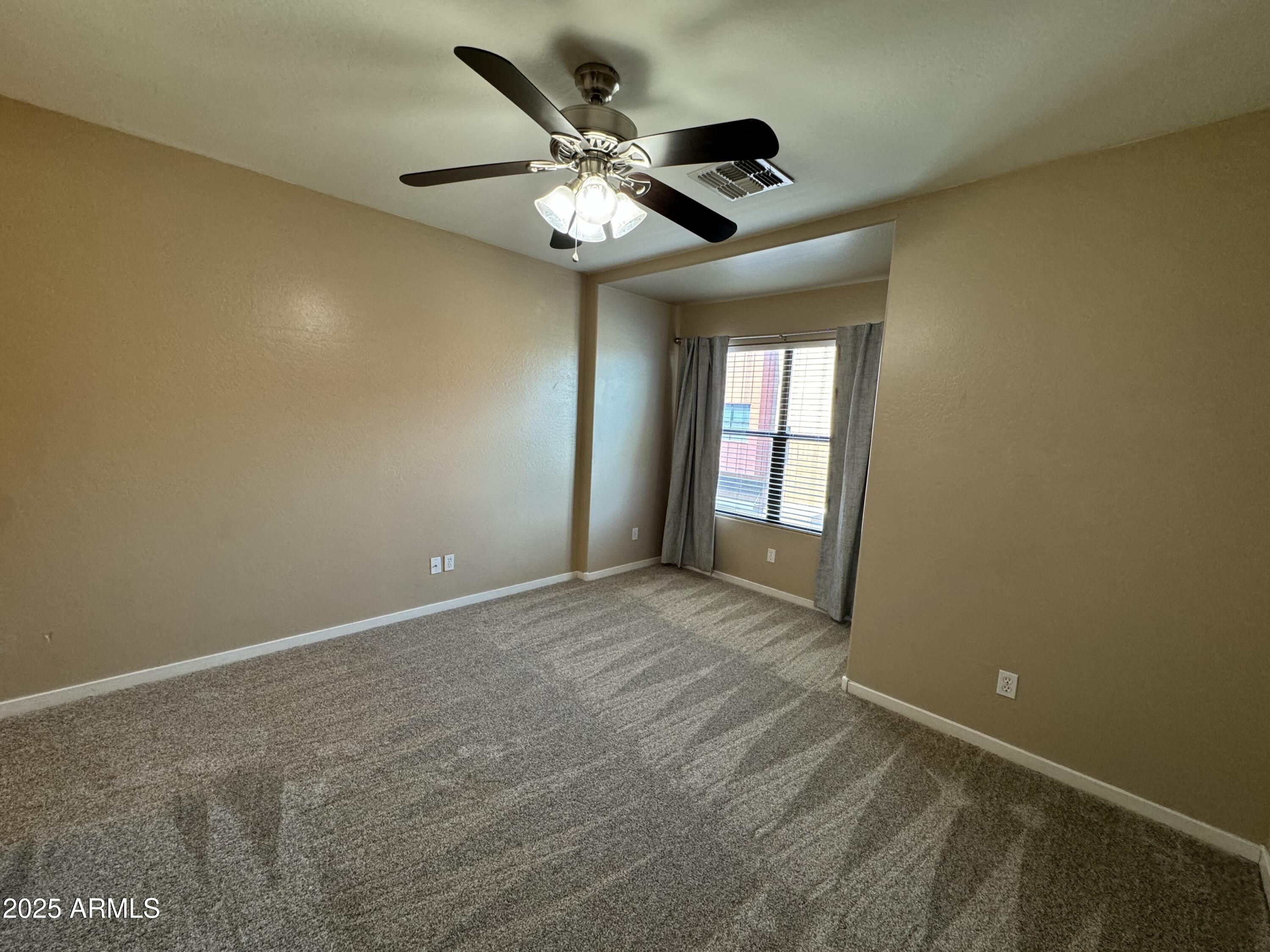 305 South Wilson Street, Unit 111 Tempe, AZ 85281 - Photo 11 of 48 a view of an empty room with a window