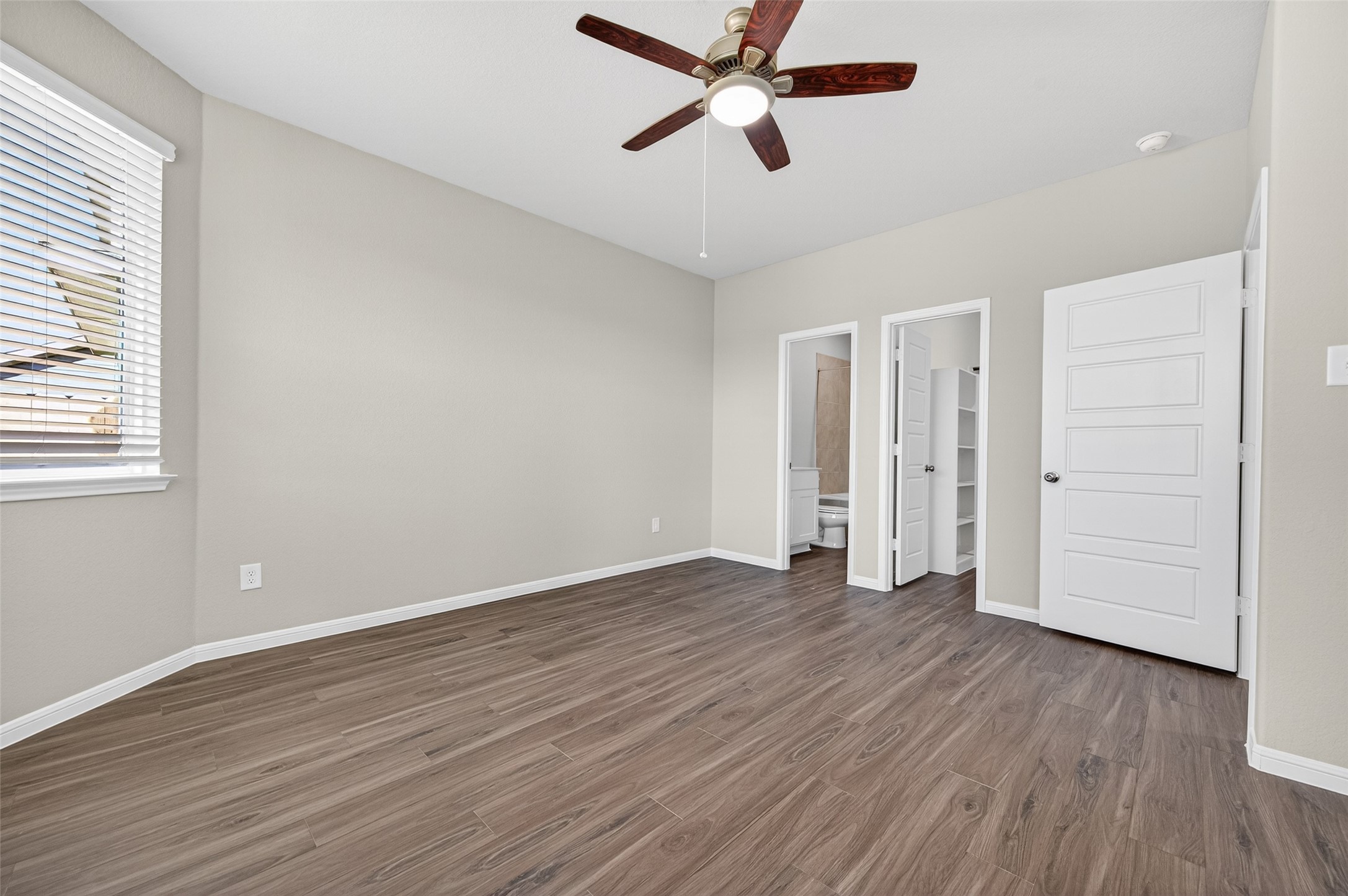 9259 Grace Rdg Drive Willis, TX 77318 - Photo 16 of 39 an empty room with wooden floor and windows