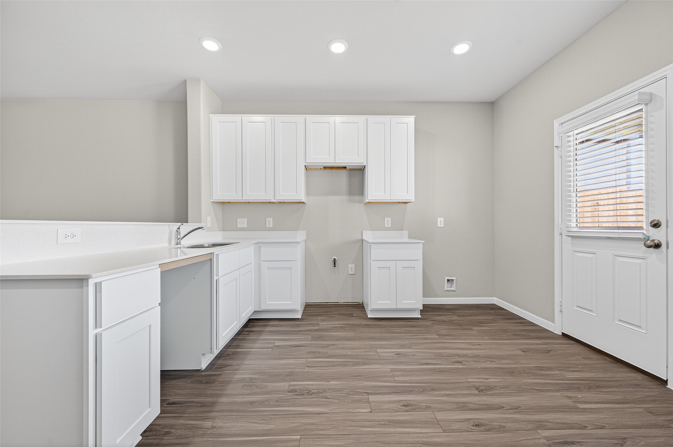 9259 Grace Rdg Drive Willis, TX 77318 - Photo 2 of 39 a kitchen with a sink cabinets and wooden floor