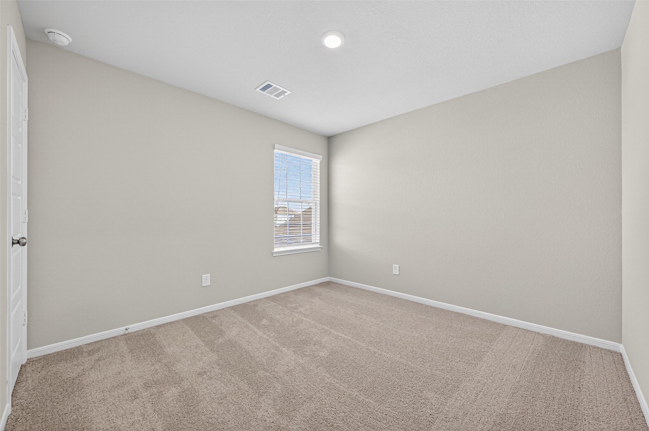 9259 Grace Rdg Drive Willis, TX 77318 - Photo 29 of 39 a view of an empty room with a window
