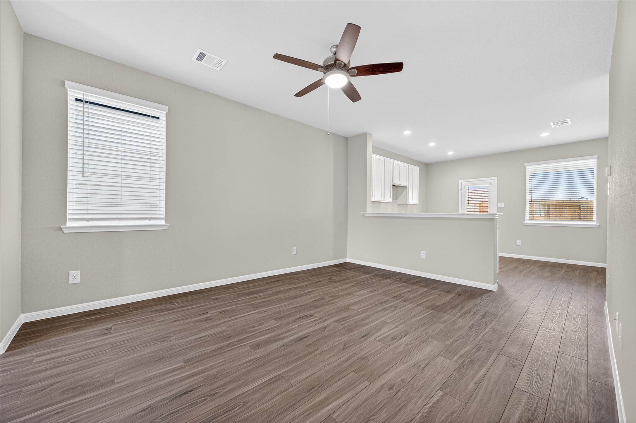 9259 Grace Rdg Drive Willis, TX 77318 - Photo 6 of 39 a view of an empty room with wooden floor and a window