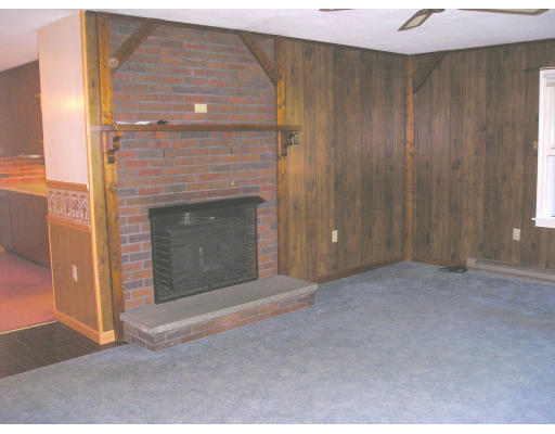 332 Bolton Road Lancaster, MA 01523 - Photo 8 of 13 a view of empty room with fireplace