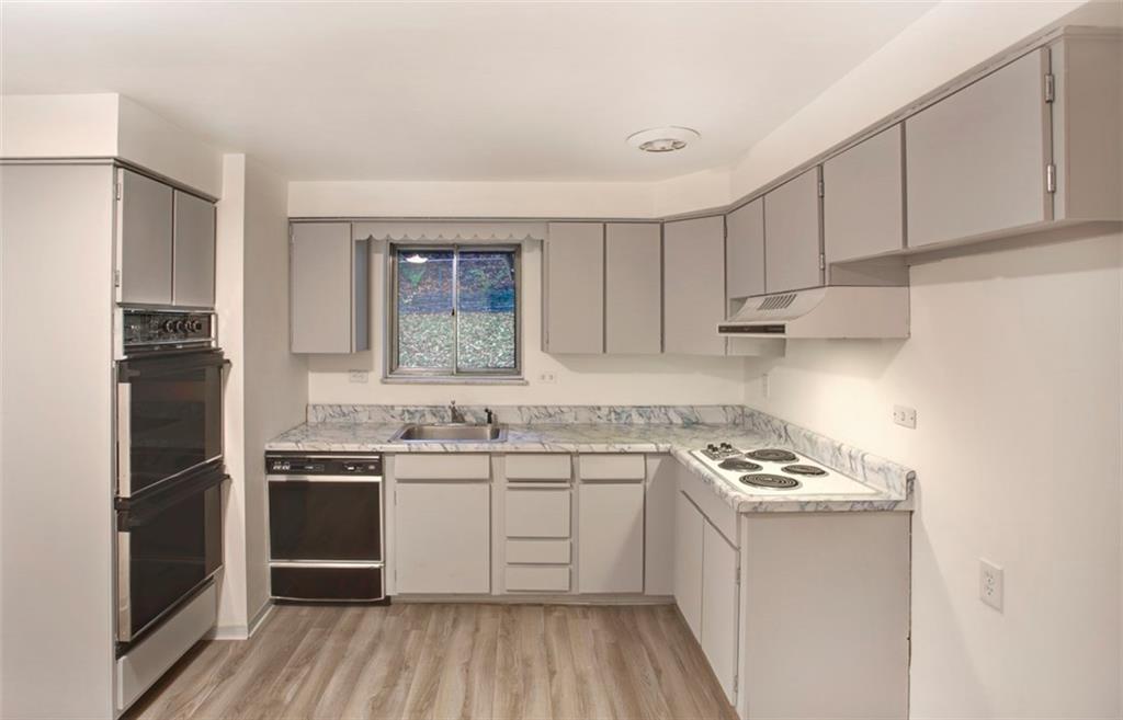 112 Washington Road Forest Hills, PA 15221 - Photo 11 of 24 Newly Painted Kitchen with Electric Cook Top and Built in Double Ovens. Lots of Cabinet Space